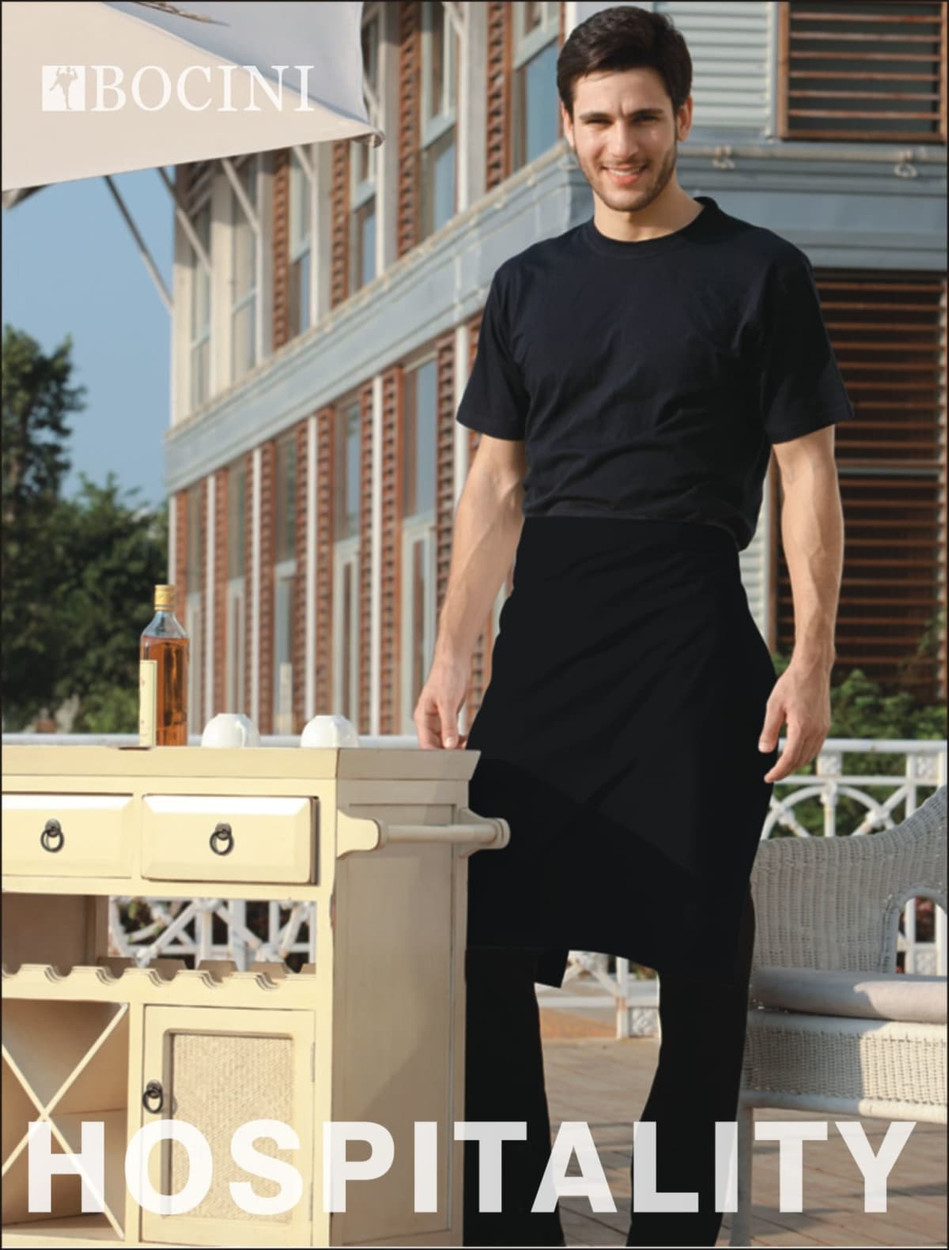 A man wearing a black polyester drill half apron stands by a table outside, featuring a logo on the apron.