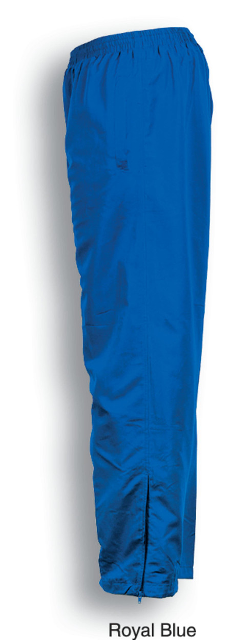 Unisex adults track pants in royal blue, featuring an elastic waistband and side slits. Includes a logo.