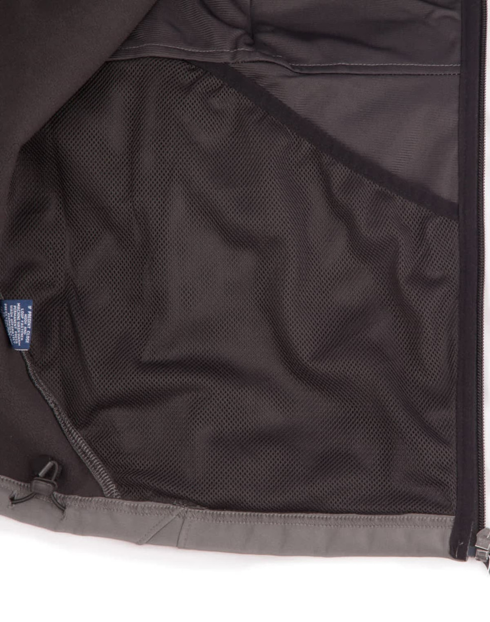 An inside view of a men's softshell high-tech jacket featuring a mesh pocket, predominantly grey in colour.