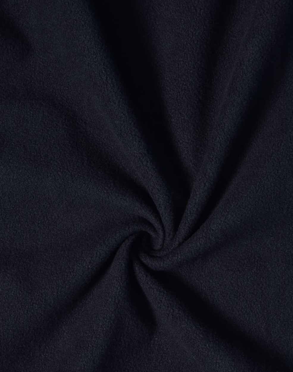 A navy softshell fabric with a smooth, textured finish, featuring a spiral pattern at the centre.