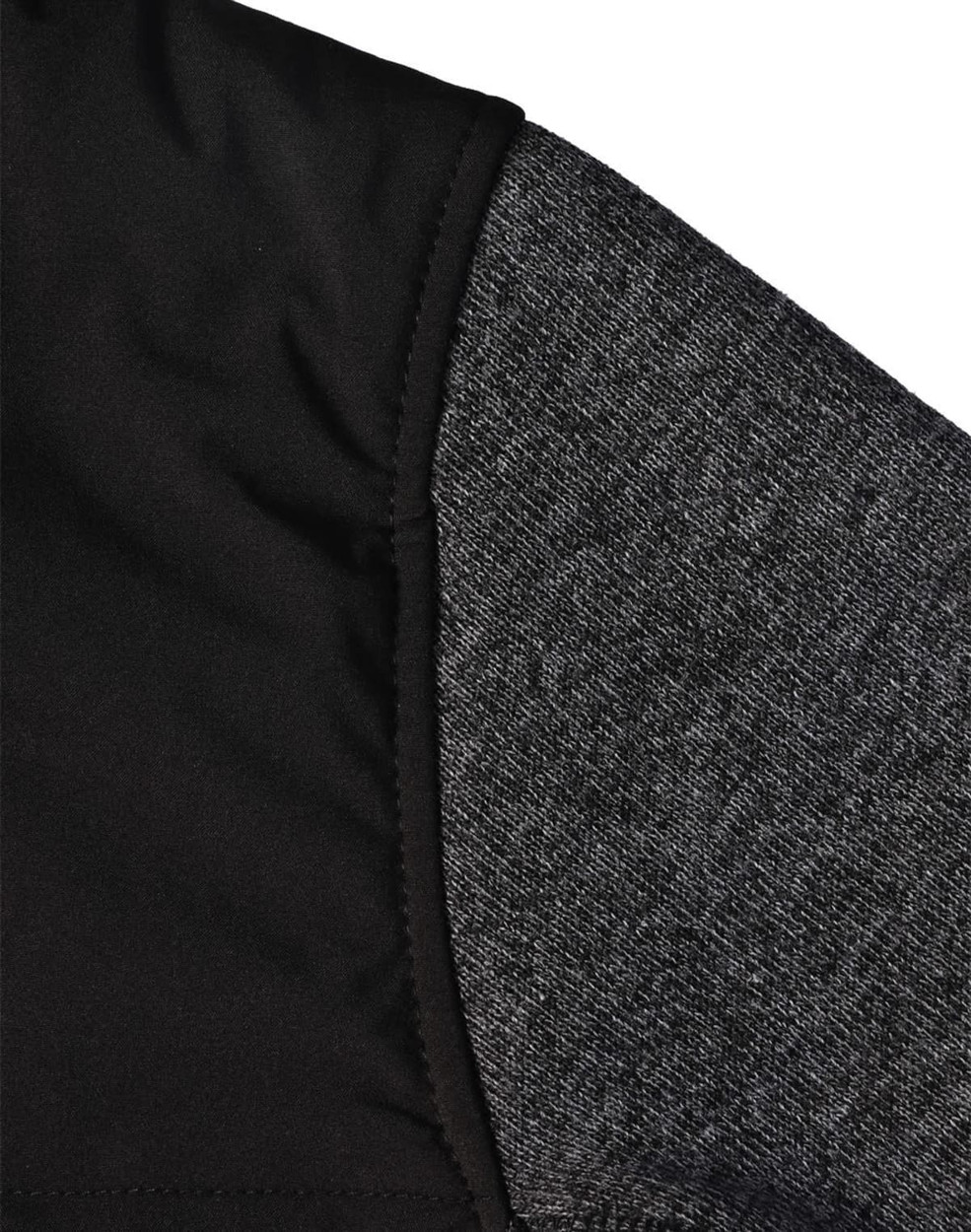 A close-up of a men's jacket featuring a quilted black body and grey heather sleeves, with a logo visible.