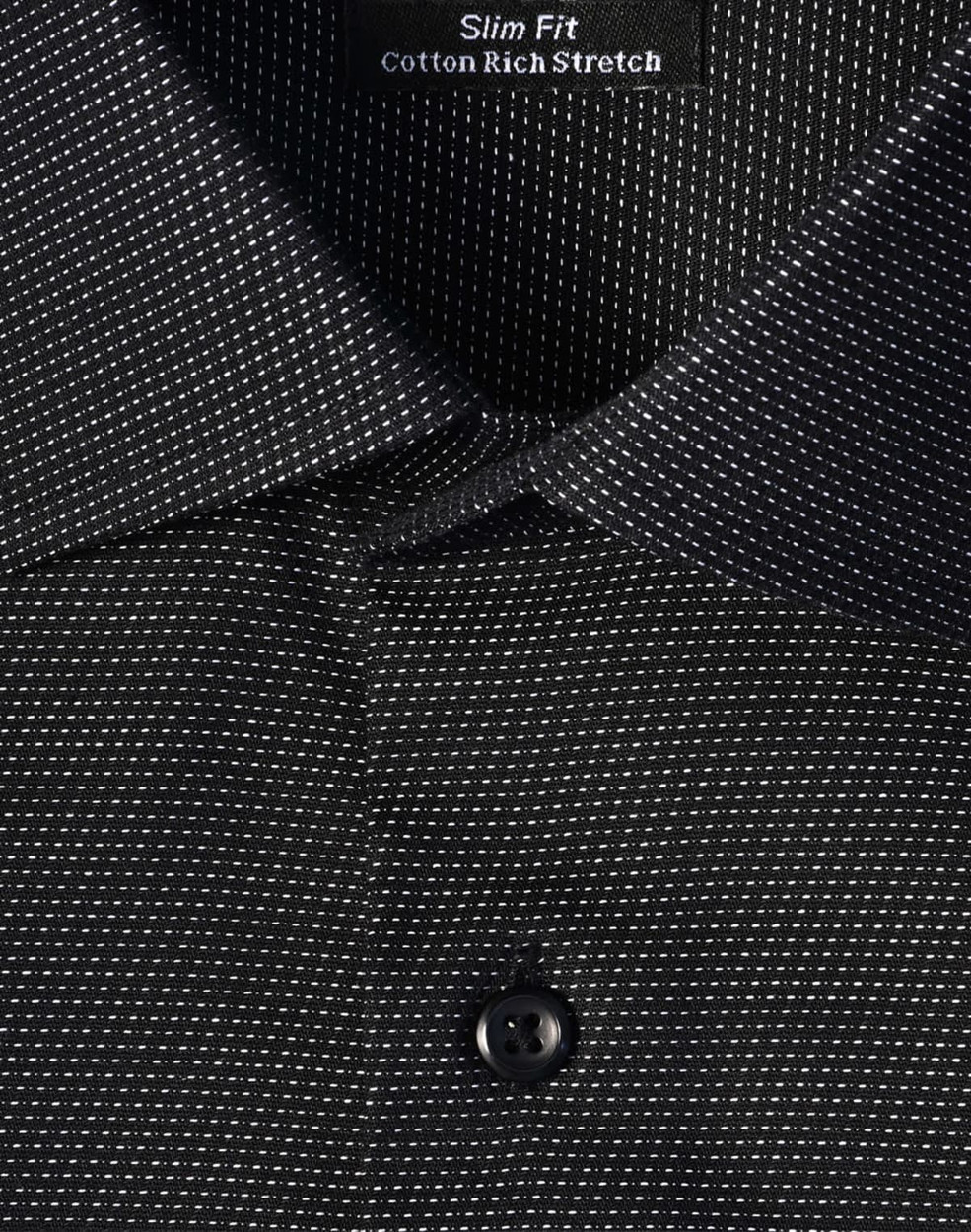 A black slim fit button-up shirt with a pin dot pattern and a collar, featuring a logo tag inside.