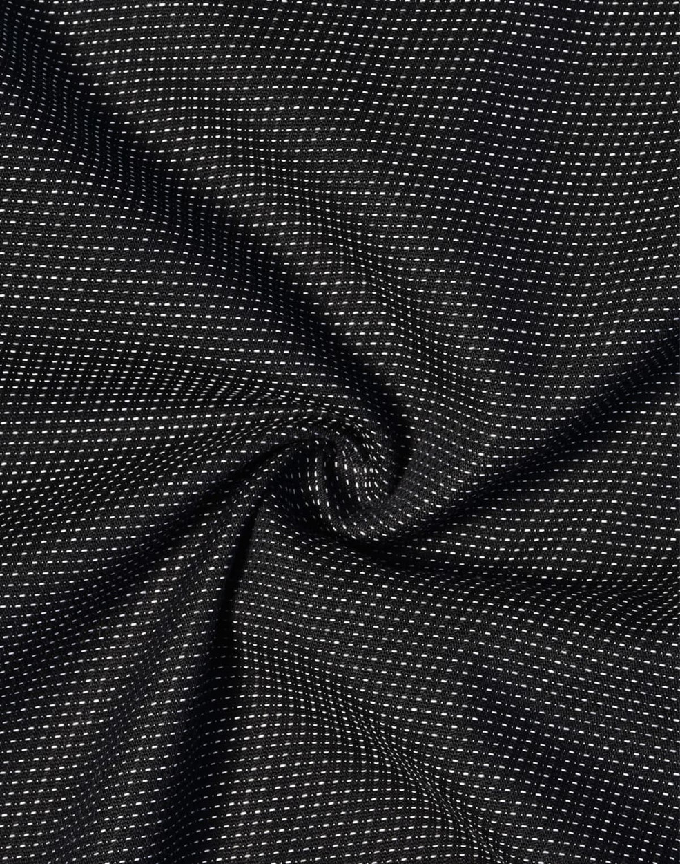A black fabric with a pin dot pattern, featuring a soft stretch texture.