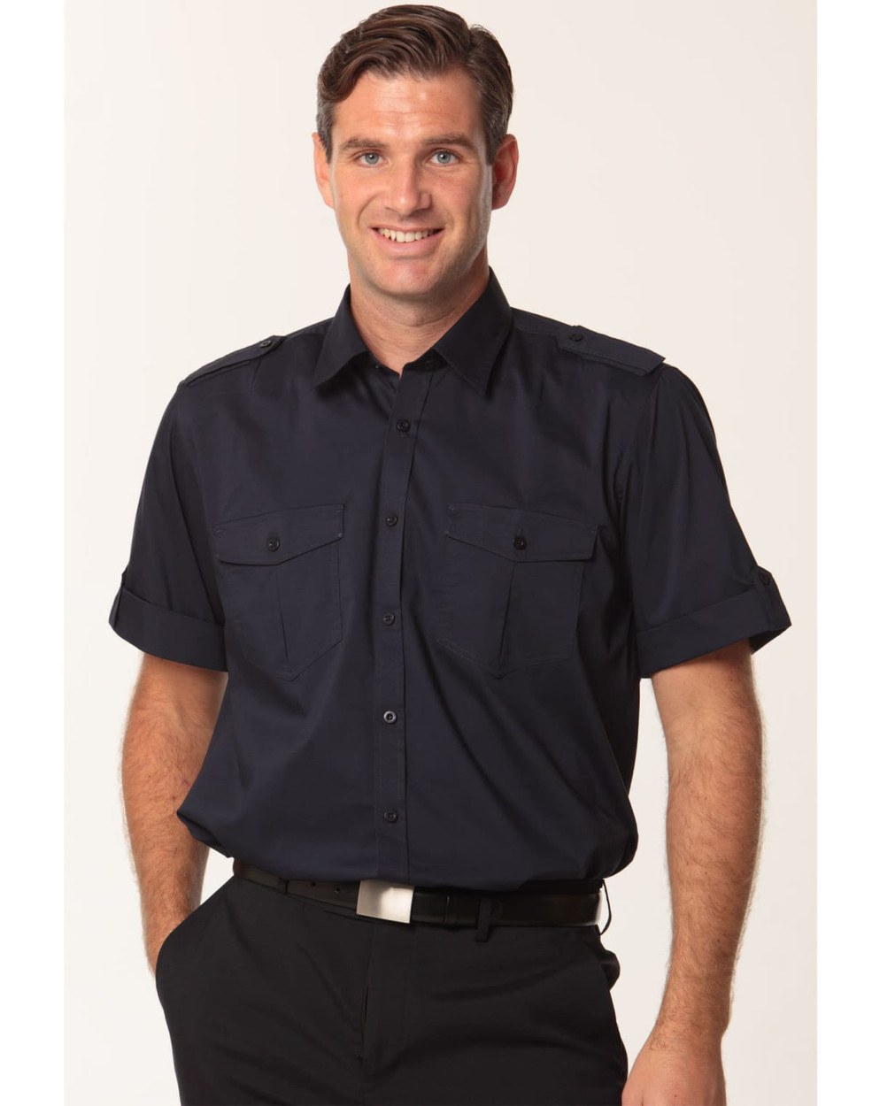 A men's short sleeve military shirt in navy with two front pockets and shoulder epaulettes, featuring a logo.
