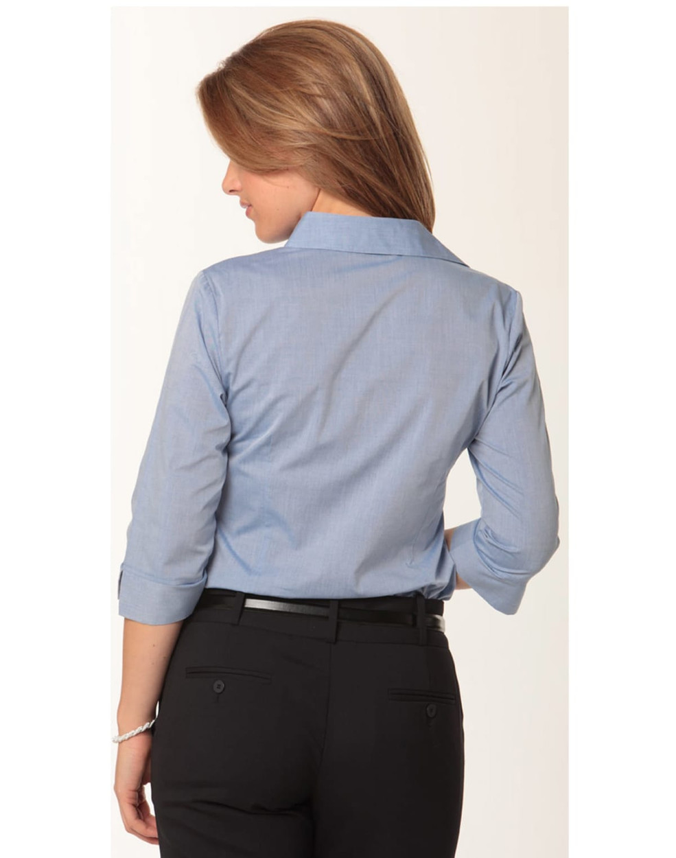 A women's fine chambray shirt in light blue with 3/4 sleeves, featuring a back view and a logo.