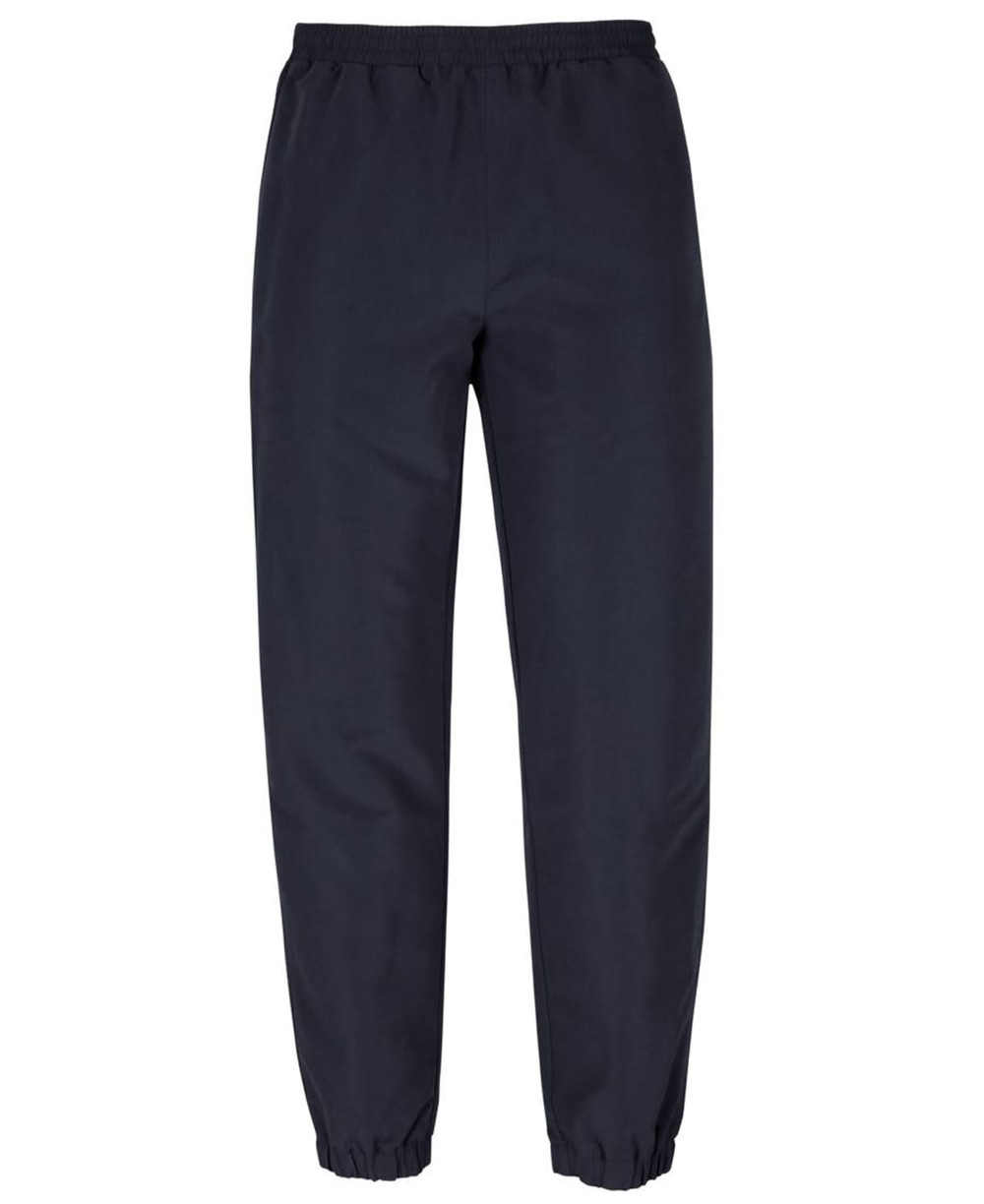 Track pants in navy blue featuring an elastic waistband and cuffed ankles. Includes a logo on the side.