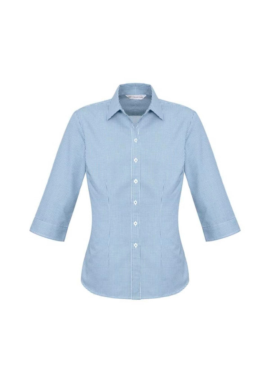 A women's 3/4 sleeve button-up shirt in a light blue check pattern, featuring a classic collar and a logo.