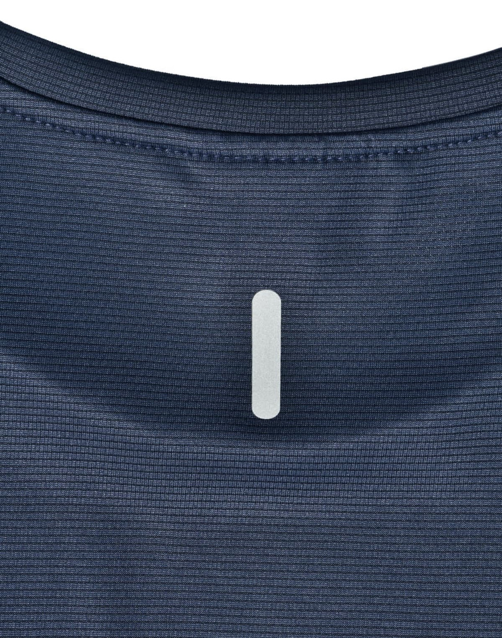 A close-up of a navy blue ladies' ultra lightweight performance t-shirt, featuring a subtle logo at the neckline.