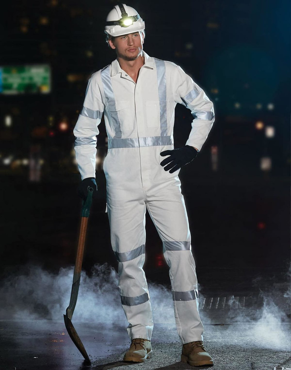 A white coverall with reflective strips, worn with gloves and a helmet, featuring a shovel in a smoky environment.
