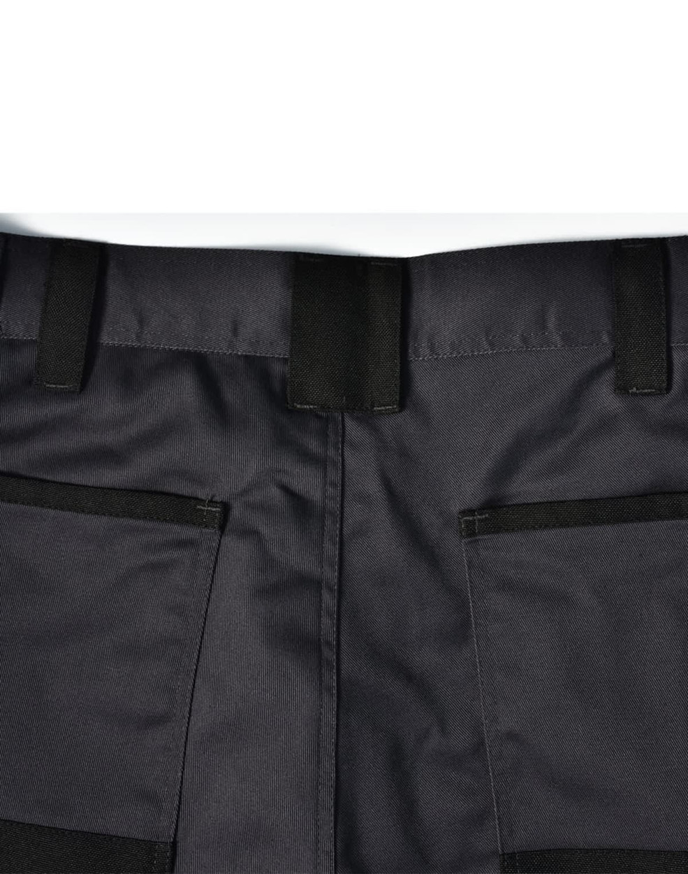 A pair of black unisex cargo work pants featuring multiple pockets and a sturdy waistband.