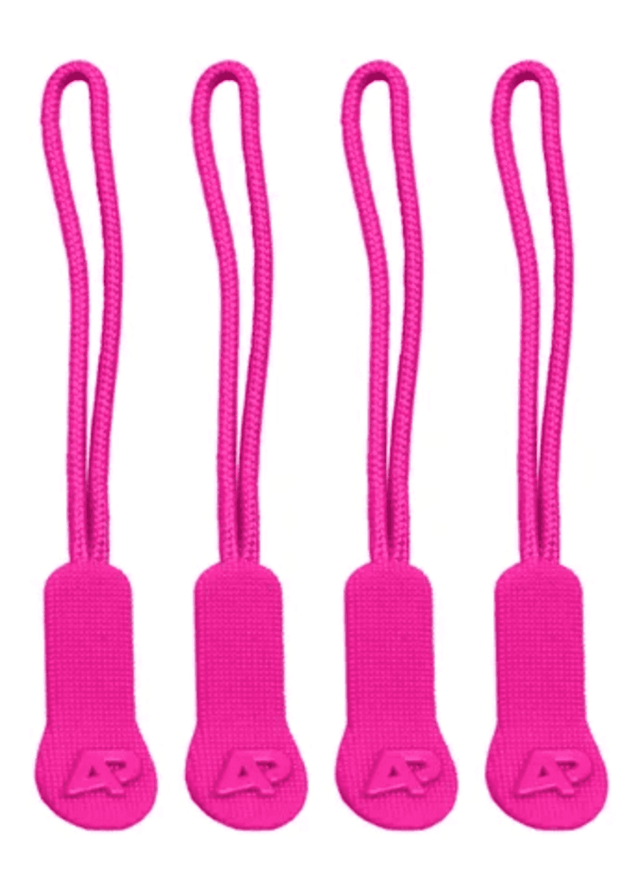 Four pink zip puller accessories made of fabric, each with a textured grip and a small logo on the tab.