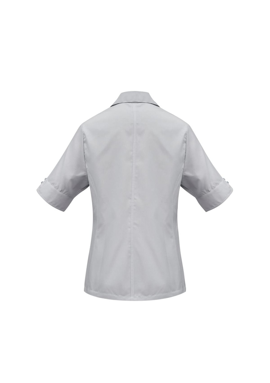 A light grey women's short sleeve button-up shirt featuring a collar and rolled sleeves. It has a subtle logo.