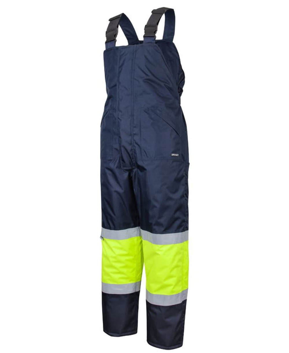 A navy bib and brace with lime reflective tape, designed as safety wear, featuring shoulder straps and wide legs.