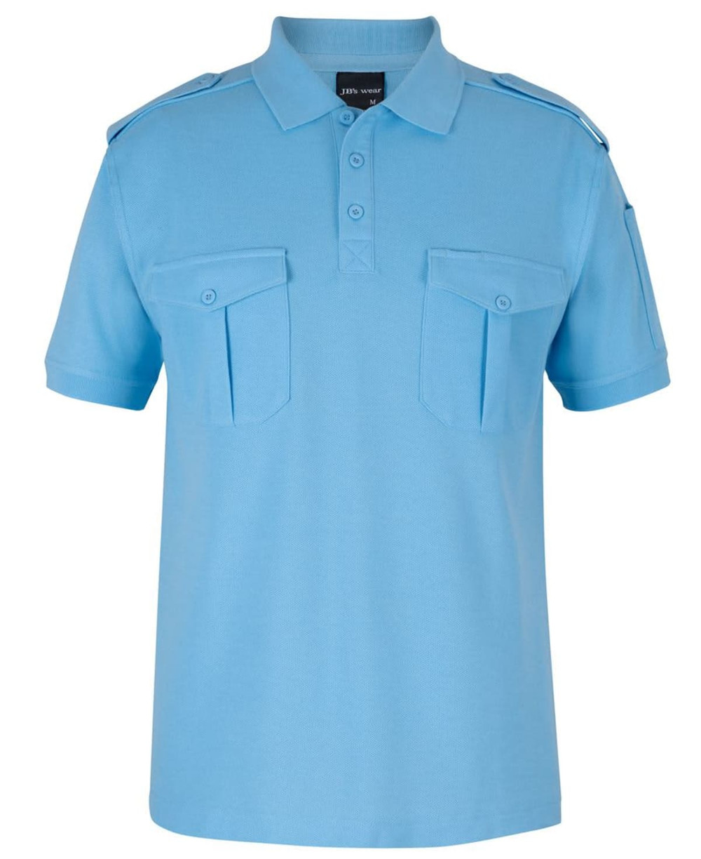 A light blue polo shirt featuring two chest pockets and shoulder epaulettes. It has a logo on the collar.