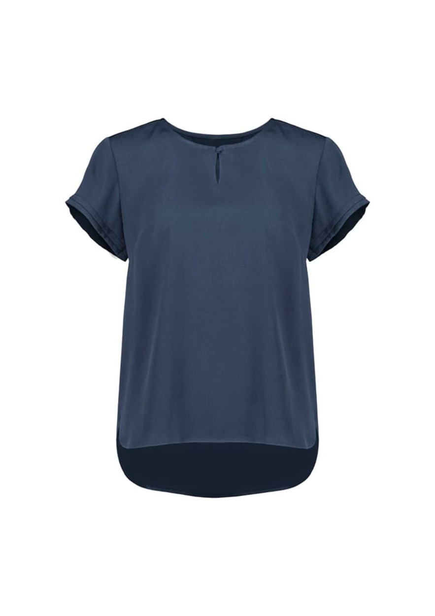 A women's short sleeve blouse in navy blue with a round neckline and a slightly longer back hem. It features rolled sleeves.