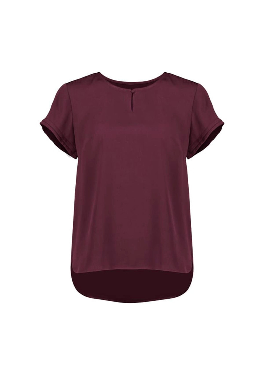 A short sleeve blouse in burgundy with a keyhole detail at the neckline and a rounded hem. It features rolled sleeves and a logo.