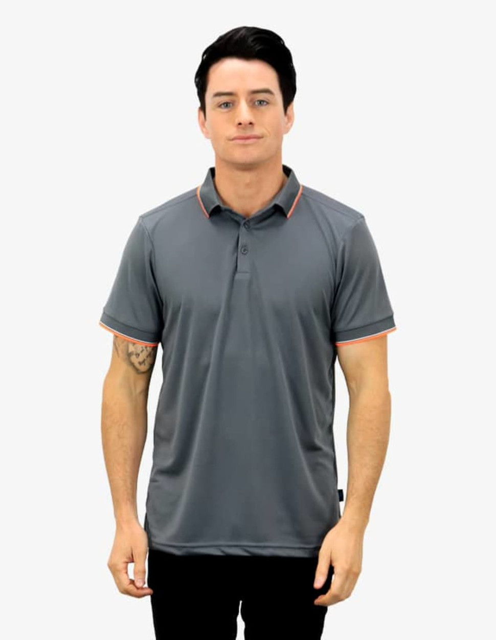A grey polo shirt with orange trim, featuring a collar and a button placket, worn by a model.