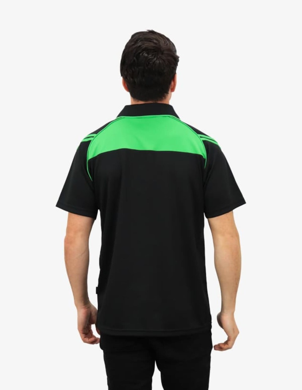 A polo shirt featuring a black base with green accents on the shoulders and back. It has a logo on the chest area.