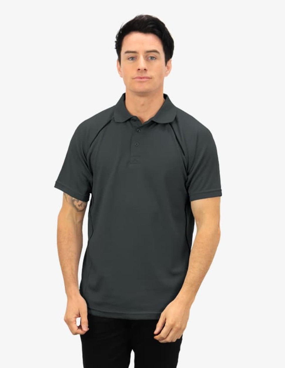 A dark green polo shirt featuring a logo, displayed by a man with short hair.