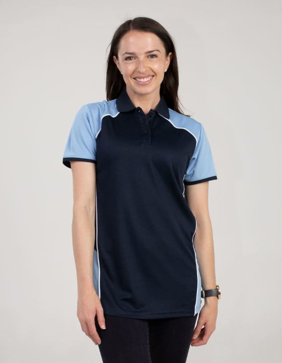 A navy and light blue polo shirt with a logo, worn by a smiling woman.