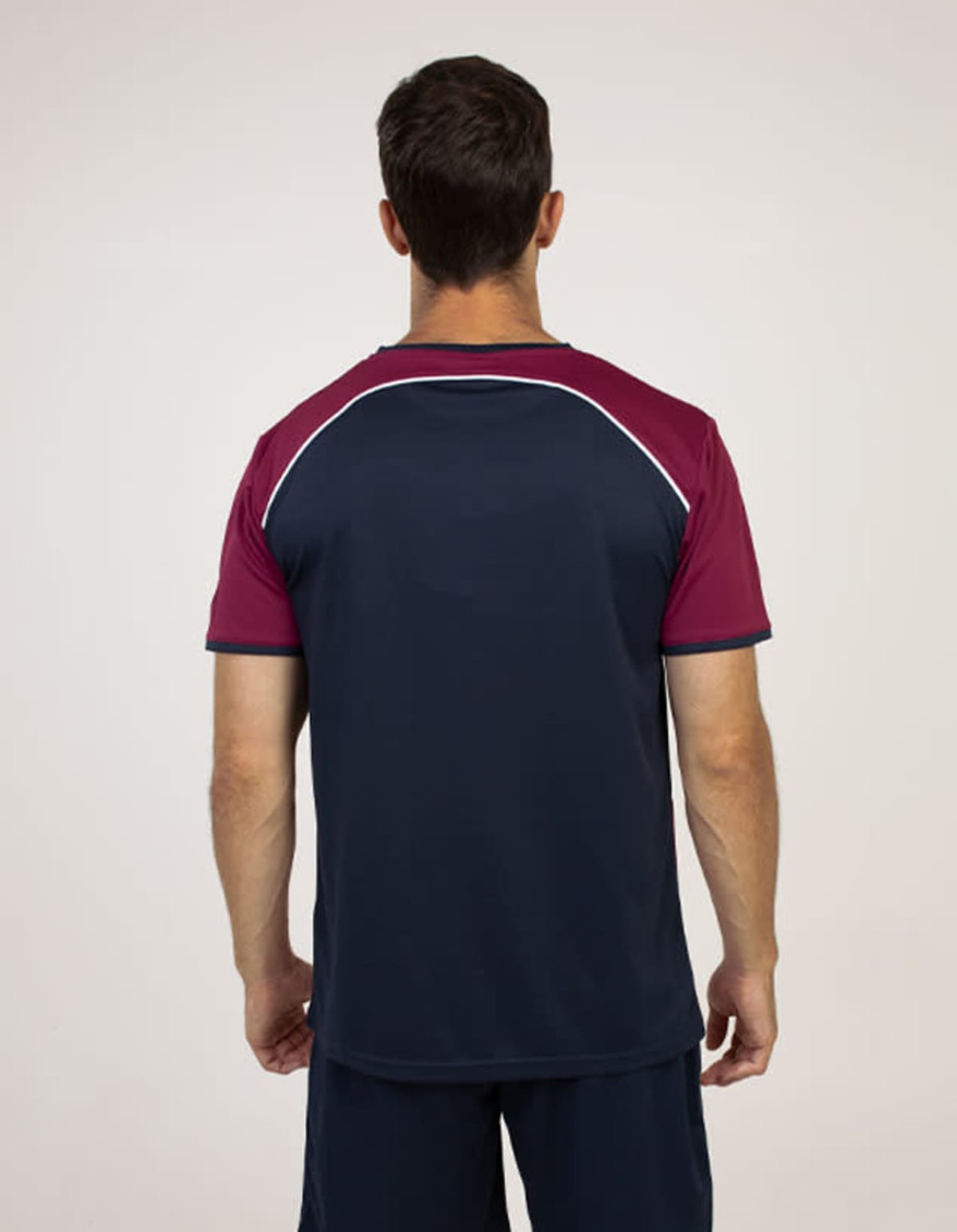 A T-shirt featuring a navy body with maroon sleeves and a logo on the back.