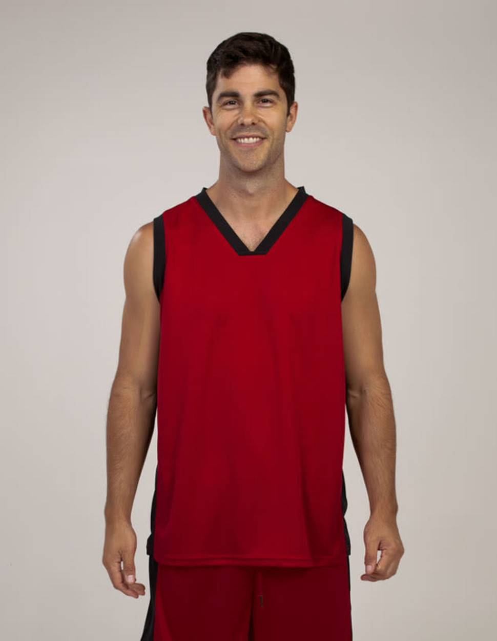 A red singlet with black accents, featuring a slight V-neck and a logo on the chest.