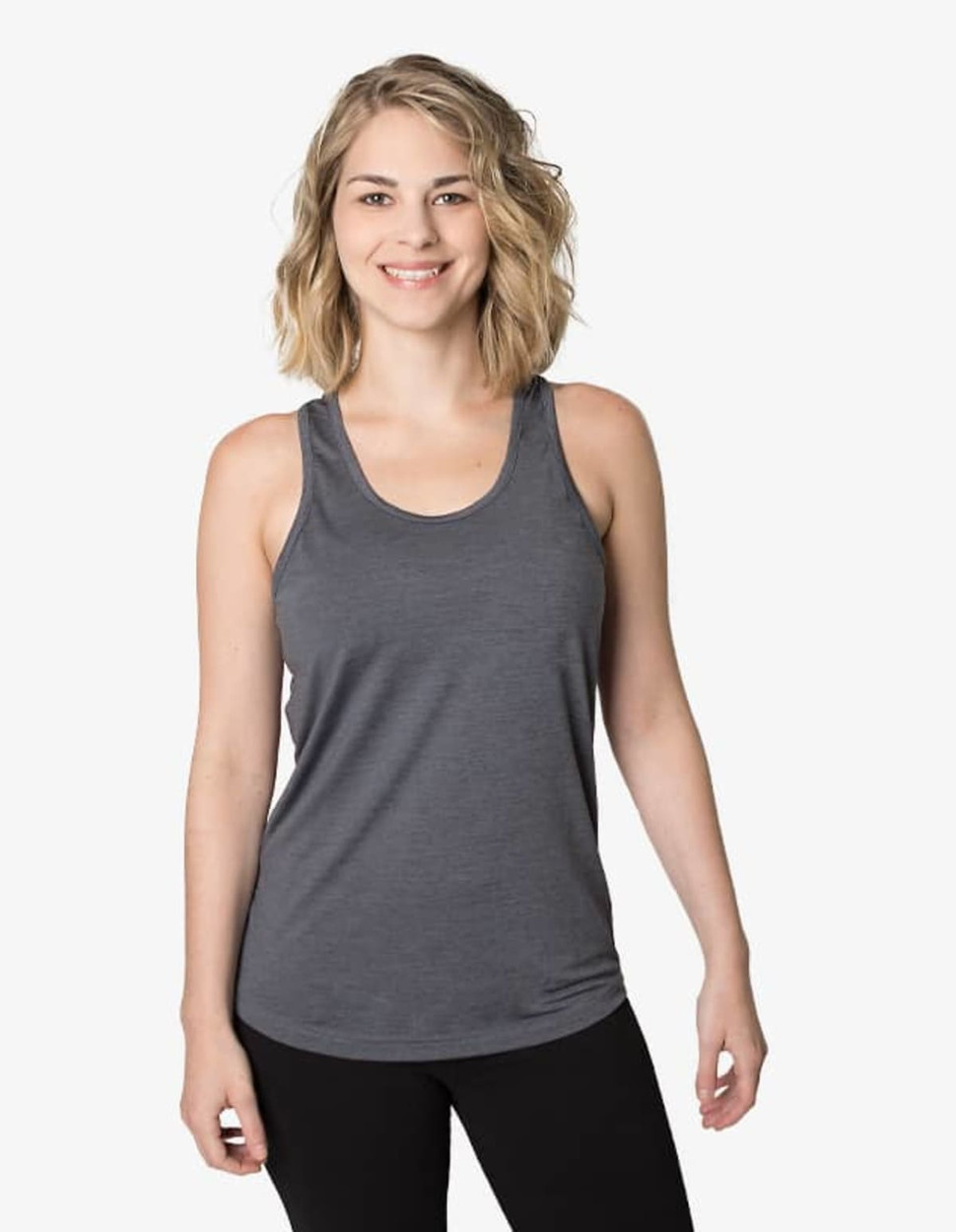 A singlet in dark grey, featuring a rounded neckline and a fitted design, worn by a model against a white background.