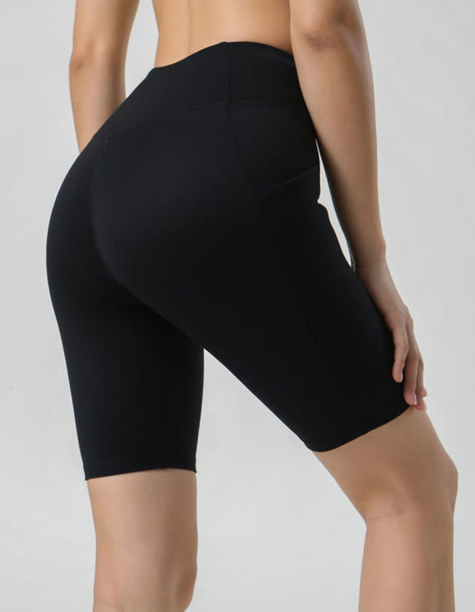 A pair of black ladies' legging shorts, featuring a high waistband and a form-fitting design.