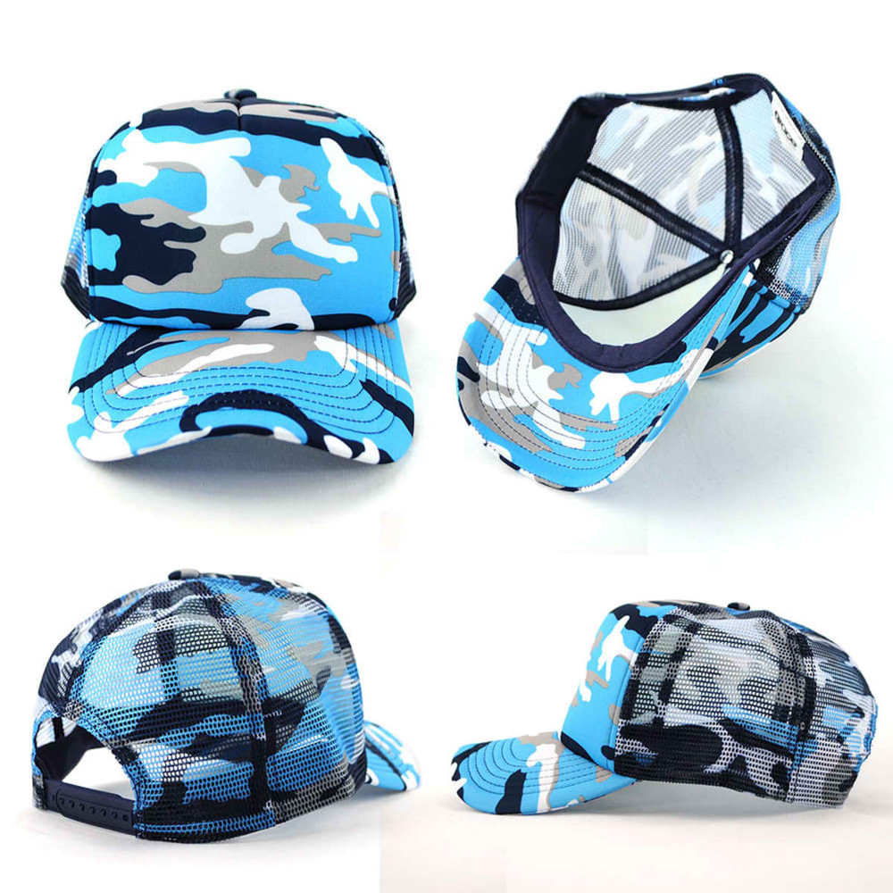 A camouflage trucker mesh cap in blue tones, featuring a mesh back and a curved brim. It includes a logo.