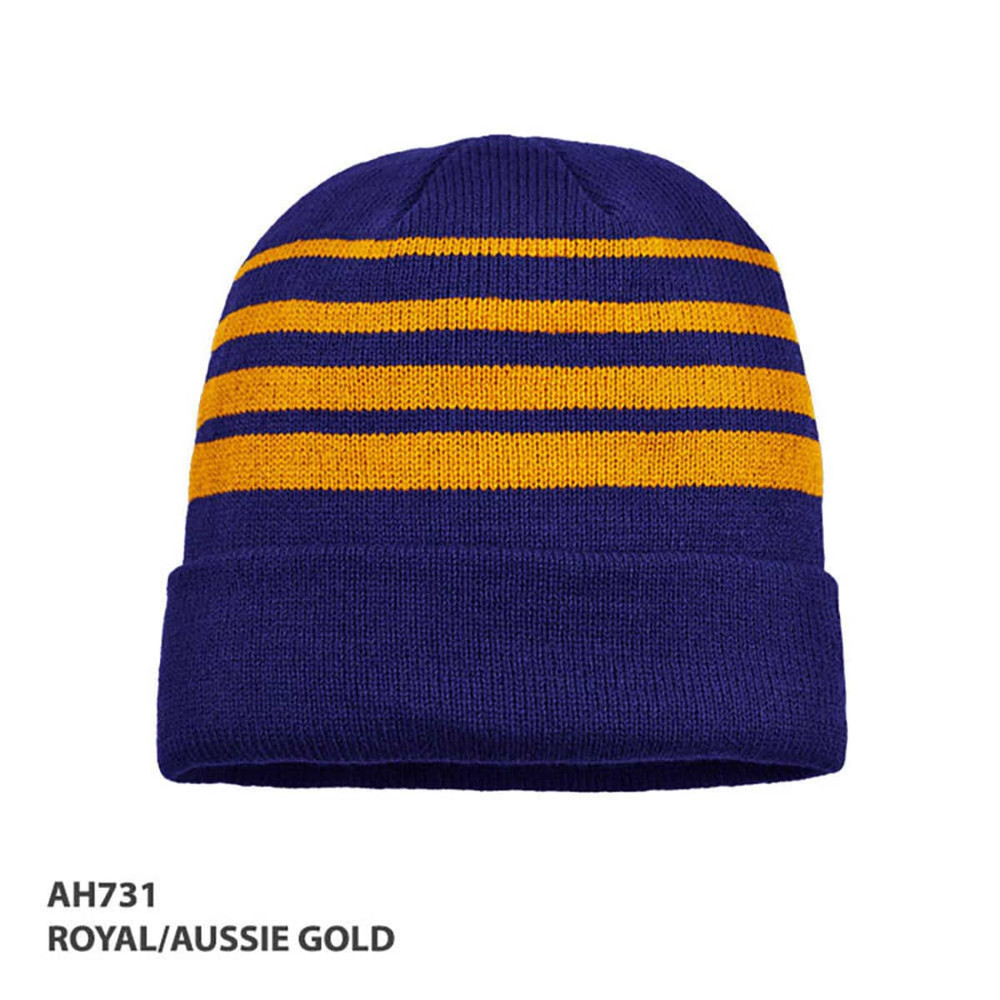Acrylic beanie in royal blue and gold with horizontal stripes and a folded cuff. Includes a logo.