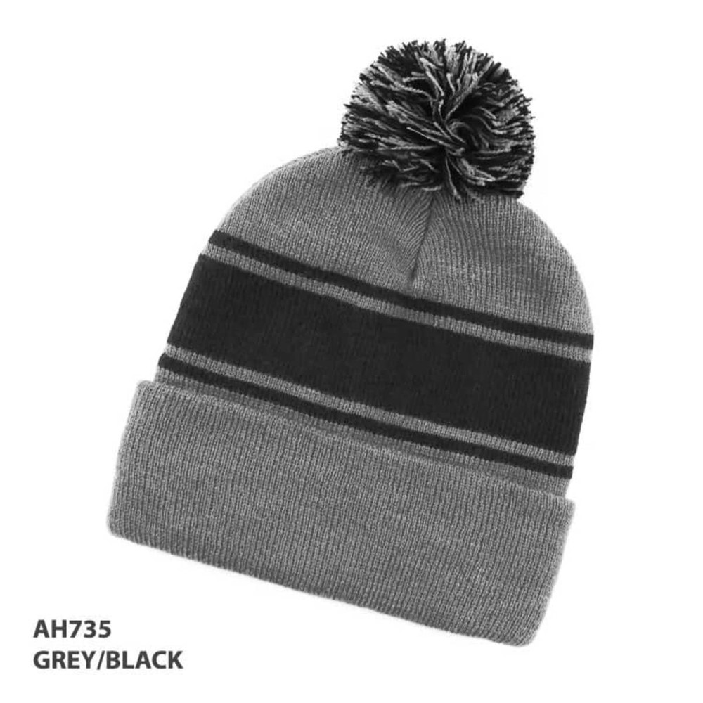 A grey and black beanie with a striped design and a pom-pom on top. Features a logo.