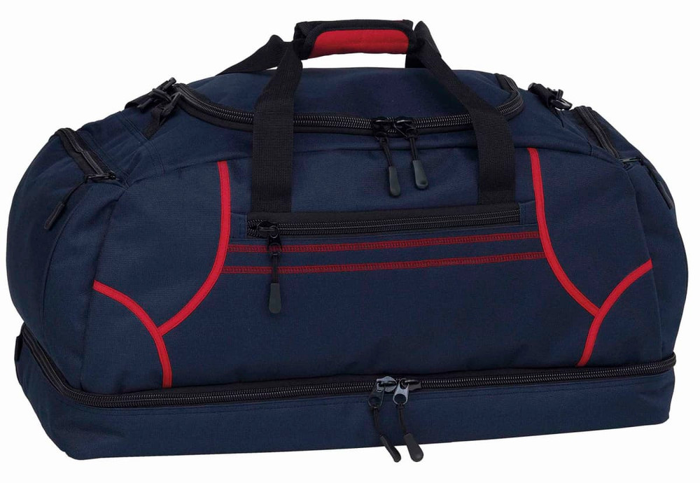 A navy blue duffle bag with red accents and a logo, featuring dual handles and zippered compartments.