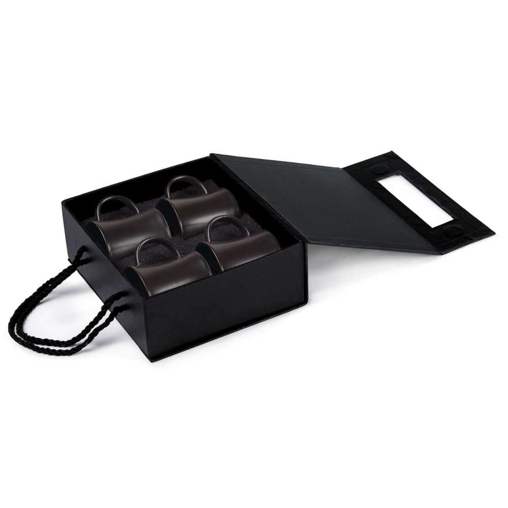 A black rectangular box containing four green espresso cups, with a handle, inside.