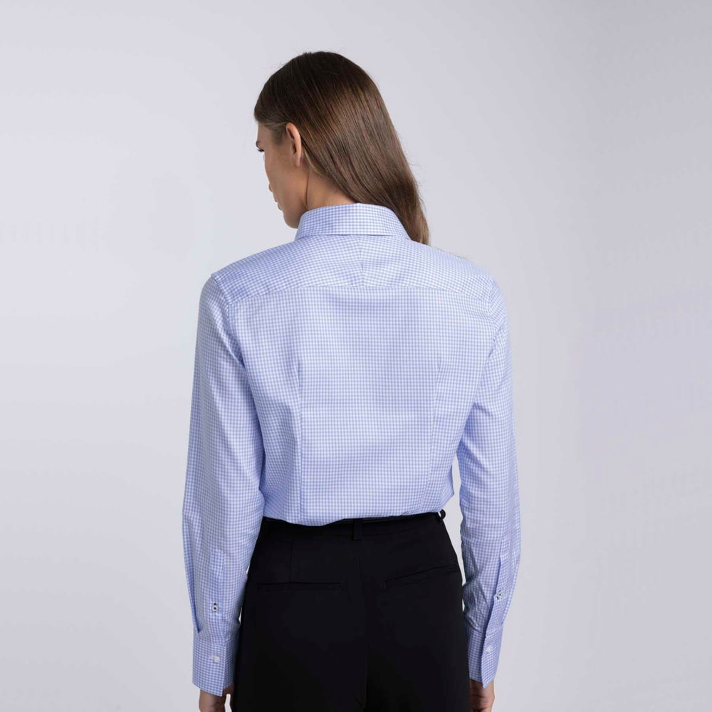 A women's button-up shirt in a light blue check pattern, featuring a classic collar and a back view.