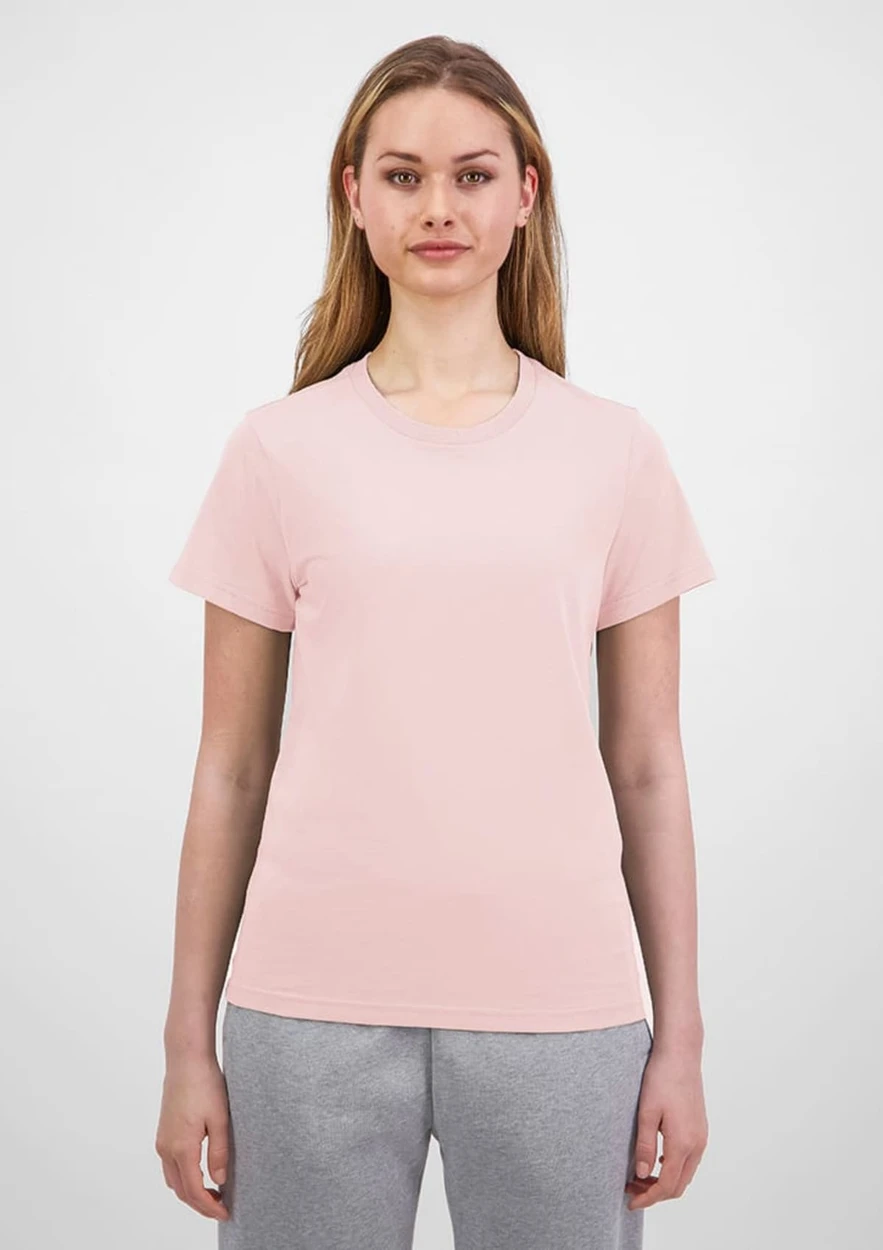 A light pink women's short sleeve tee with a fitted design, featuring a logo on the front.