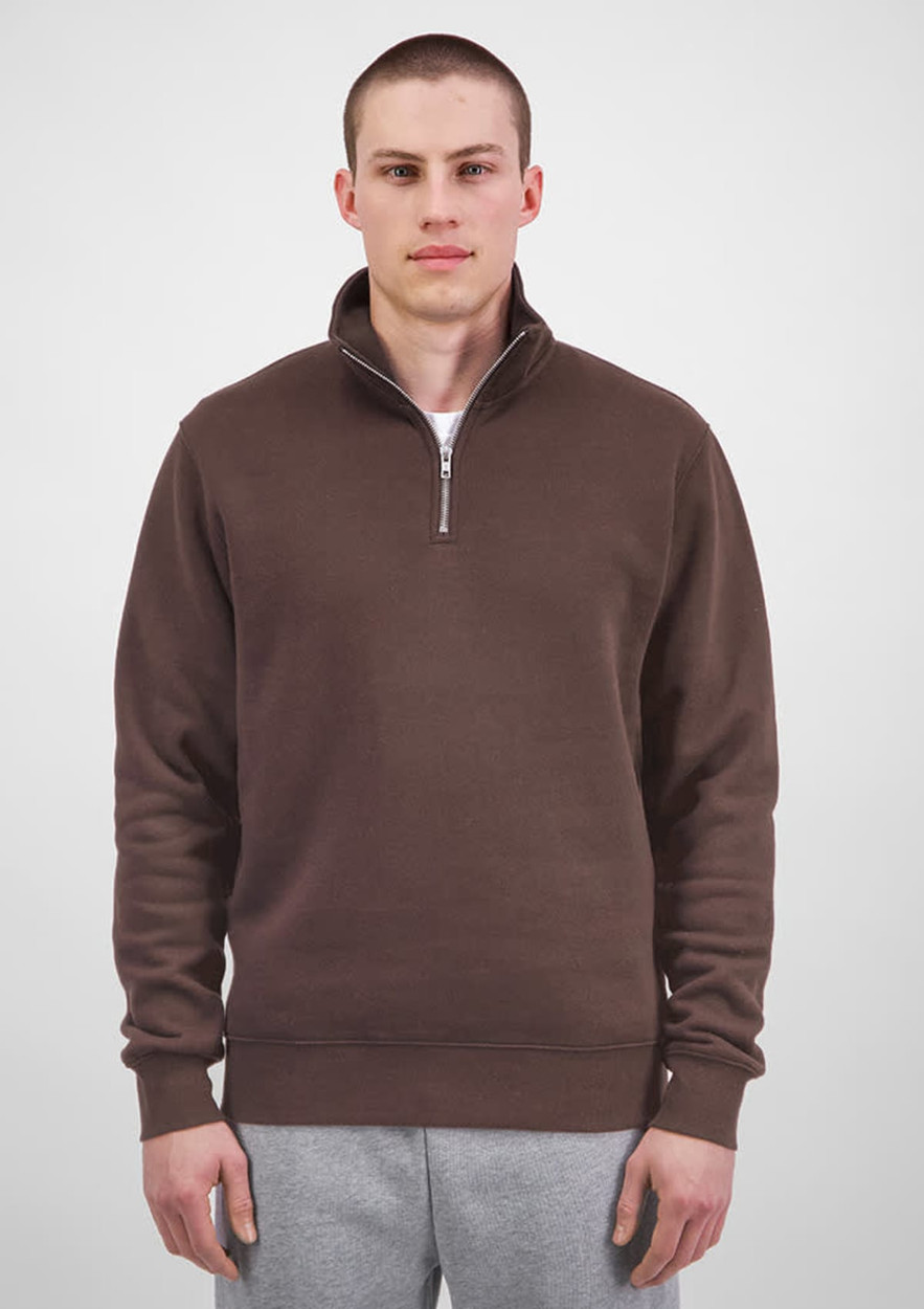 A brown 1/4 zip jumper for men, featuring a collar and ribbed cuffs, displayed on a model.