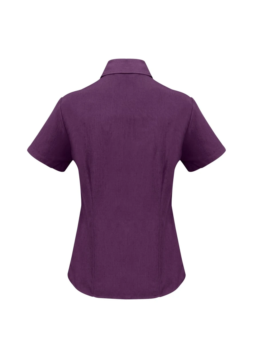 A purple women's short sleeve button-up shirt with a collar and a slightly tailored fit, featuring a logo.