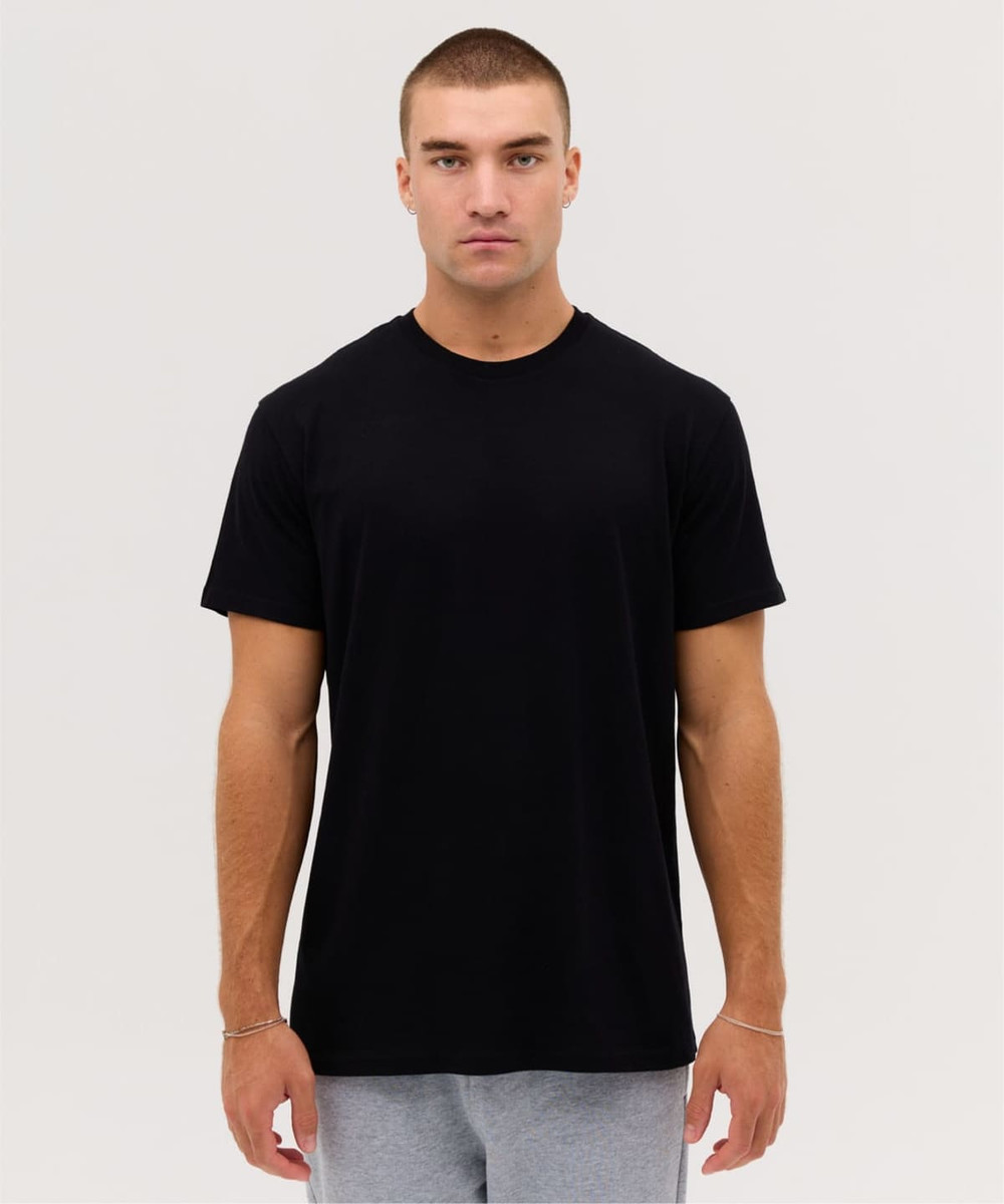 A plain black t-shirt featuring short sleeves and a round neckline, presented on a male model.