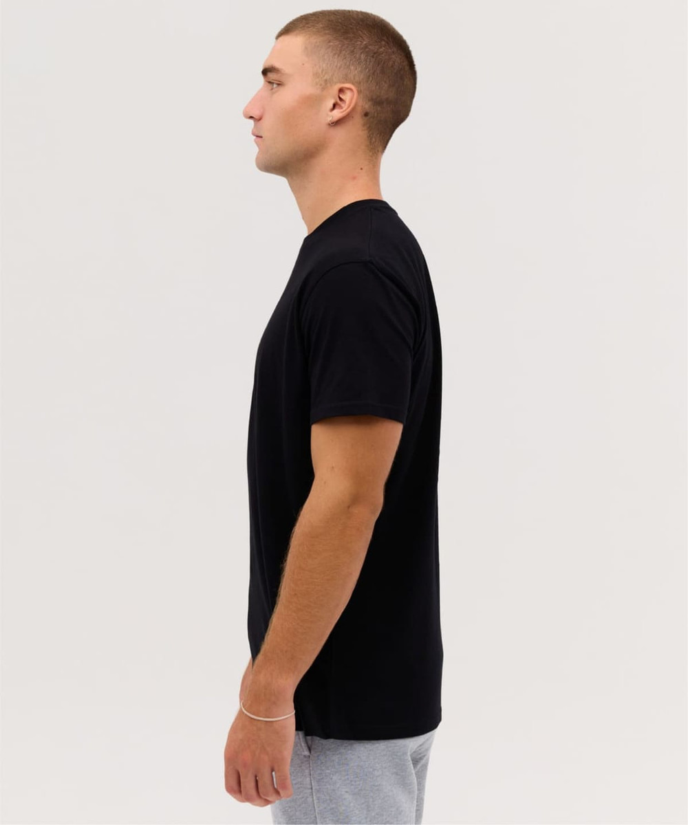 A black singlet shirt displayed on a model in profile. Features a simple design and includes a logo.