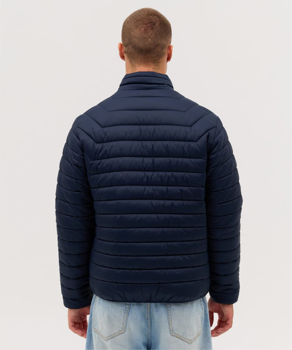 A navy blue puffer jacket with a high collar and horizontal quilting, featuring a logo on the back.