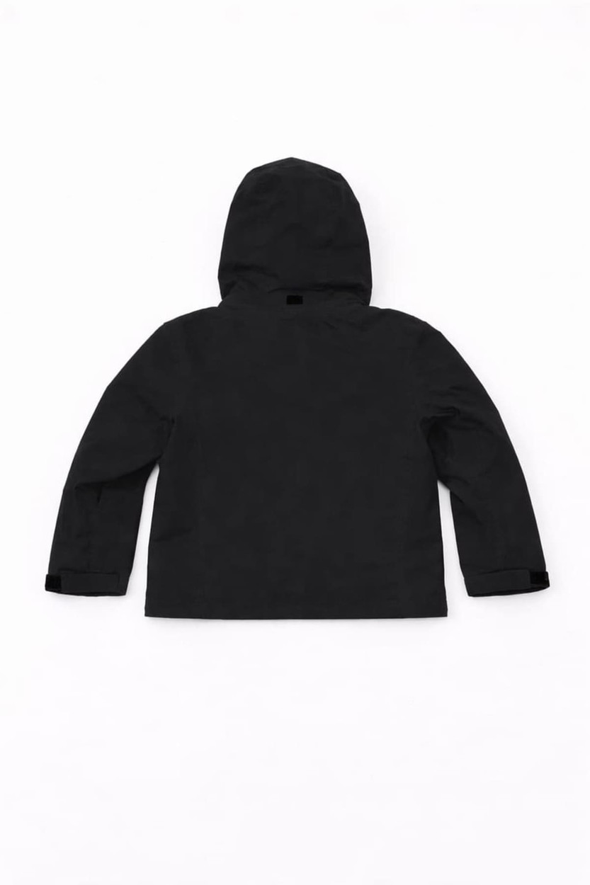 A black Youth Core Weather Jacket with a hood and long sleeves, featuring a logo on the back.