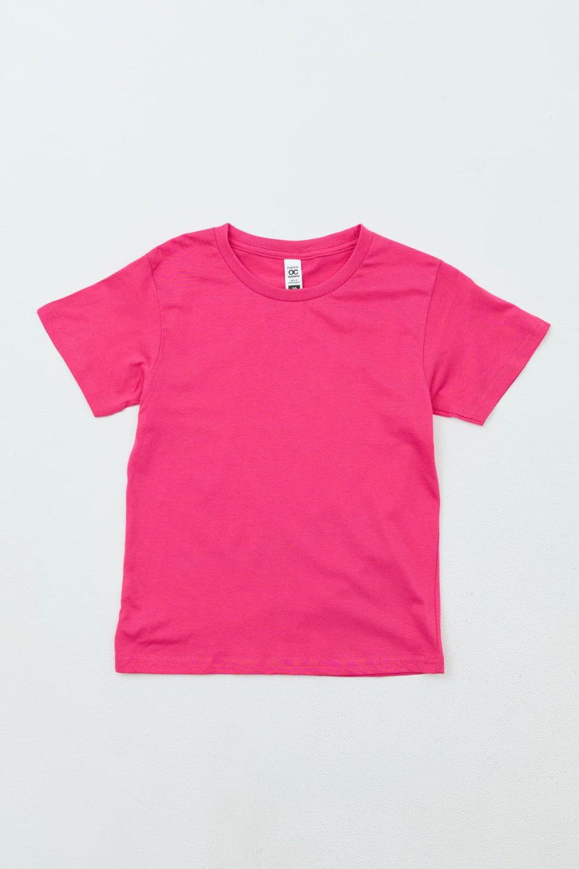A bright pink Youth Essential Tee with short sleeves, featuring a simple design and a brand logo.