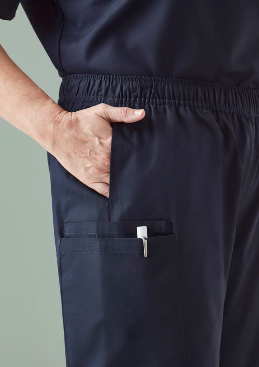 A pair of men's scrub pants in navy with an elastic waistband and multiple pockets. Features a logo.