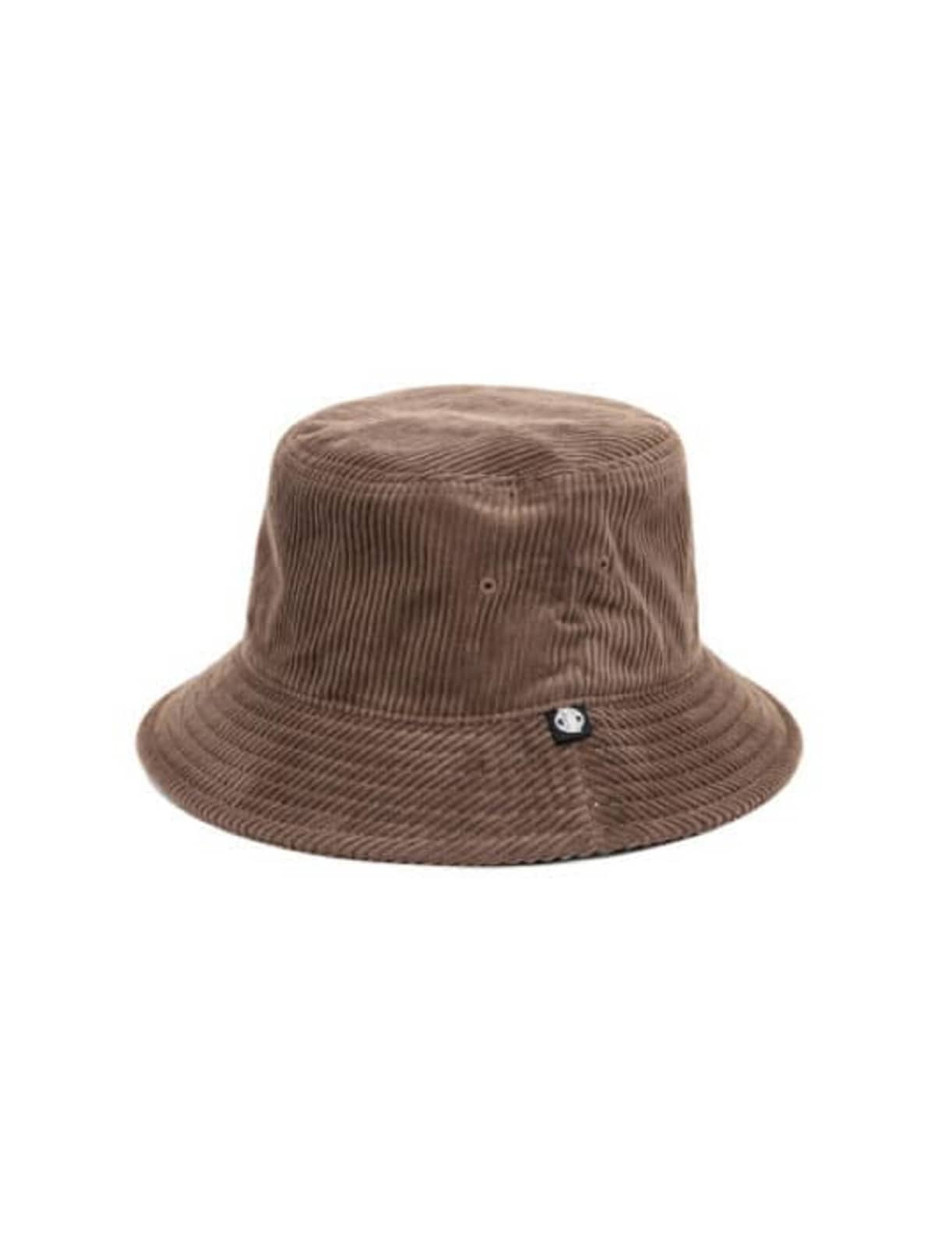 A brown cord bucket hat featuring a small logo on the side. The hat has a wide brim and a textured surface.