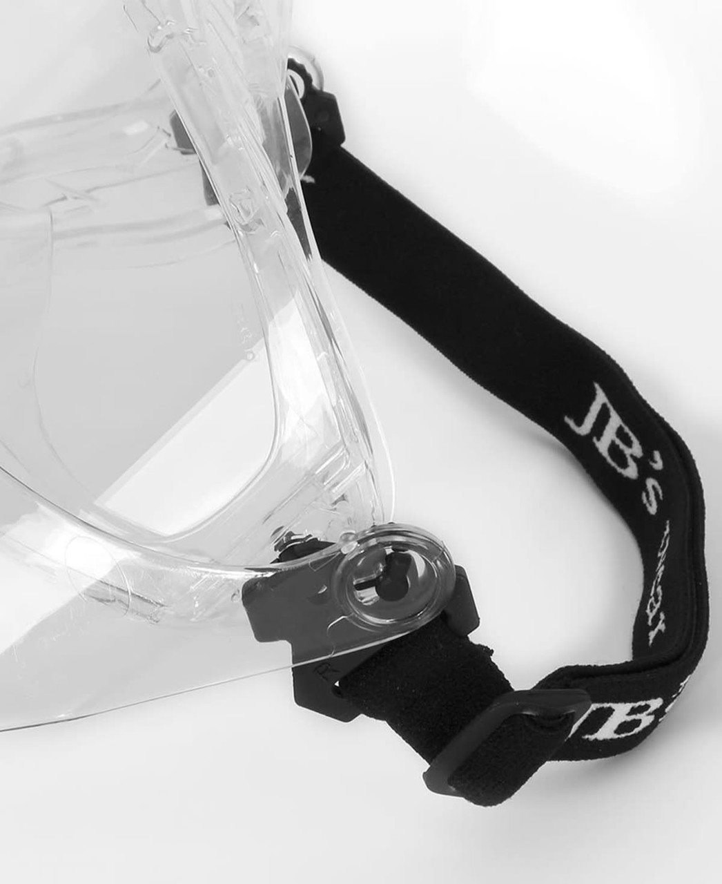 A clear face mask with an adjustable black strap, featuring a logo.