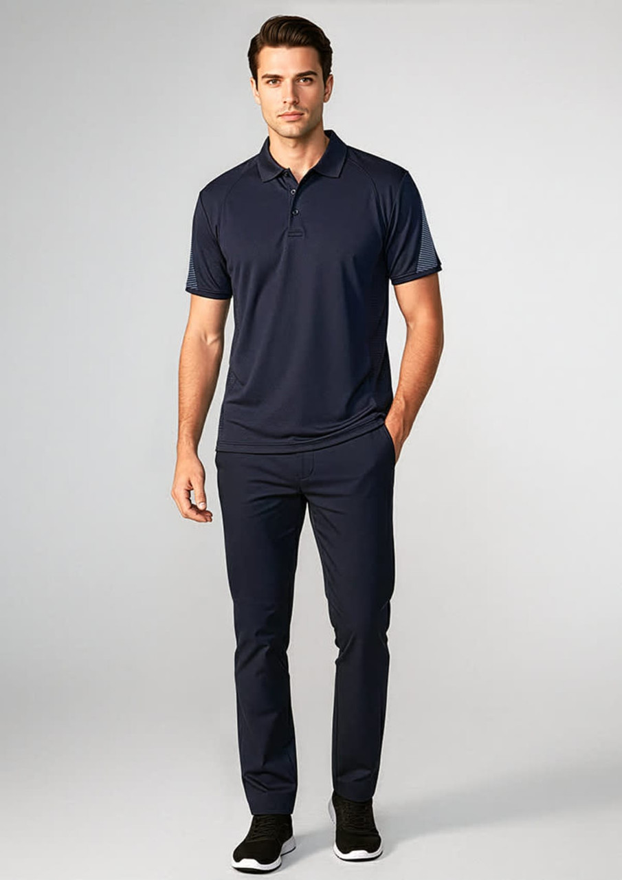 A navy short sleeve polo shirt worn by a model, paired with matching navy trousers and black shoes.