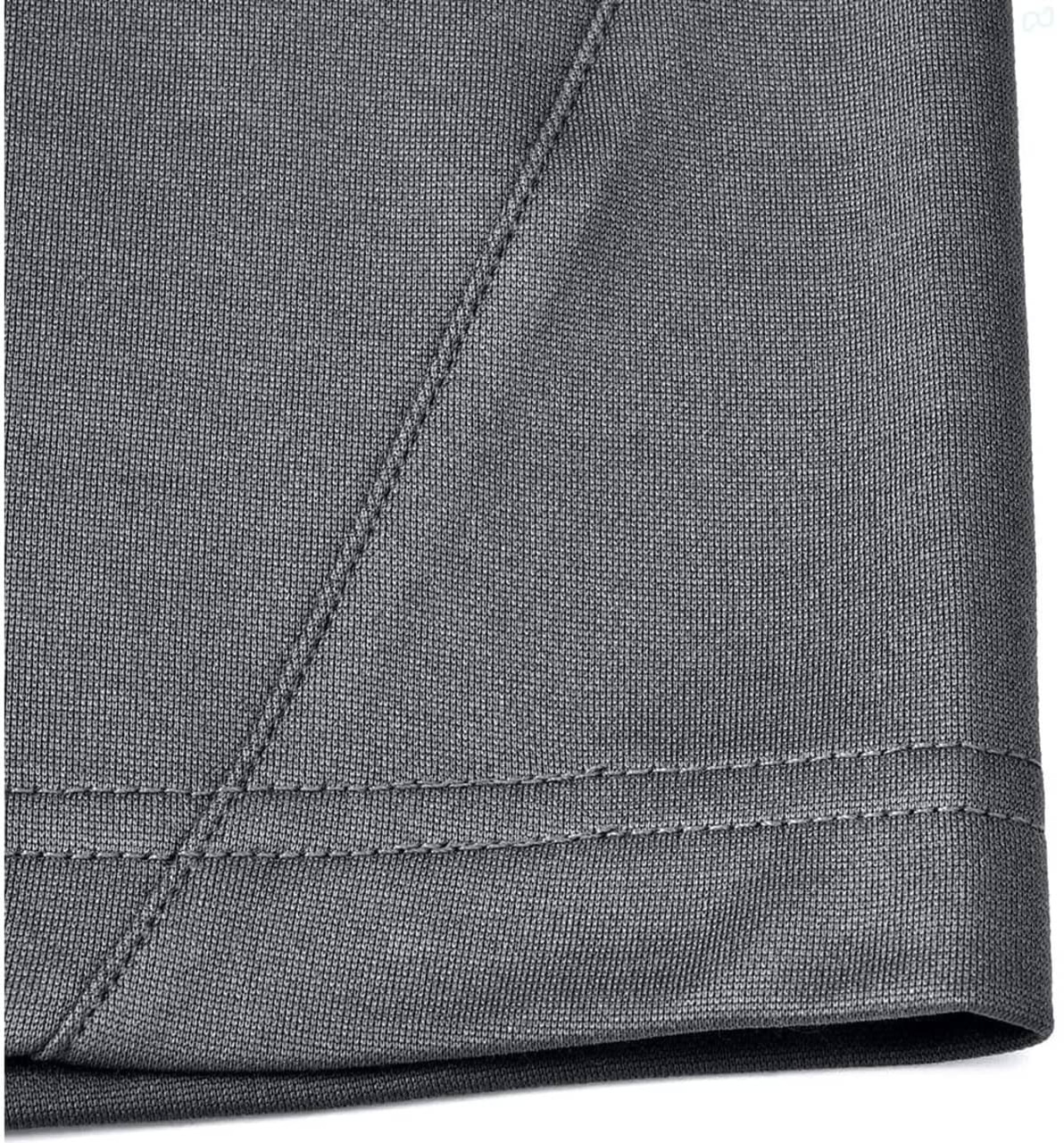A close-up of the hem and fabric of a grey men's sustainable polo shirt, featuring a stitched edge.