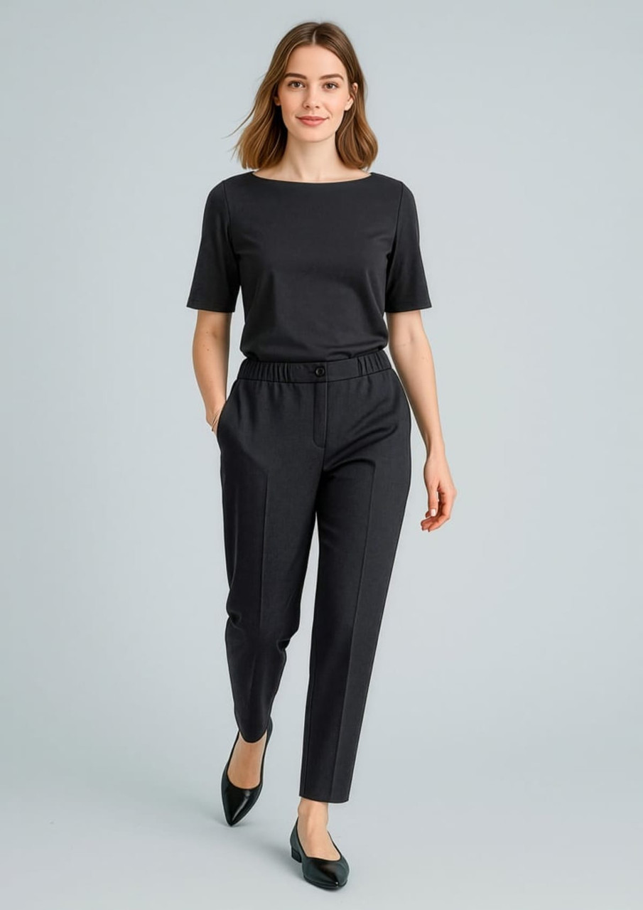 A pair of black stretch waist pants paired with a matching black top, featuring a relaxed fit and pockets.