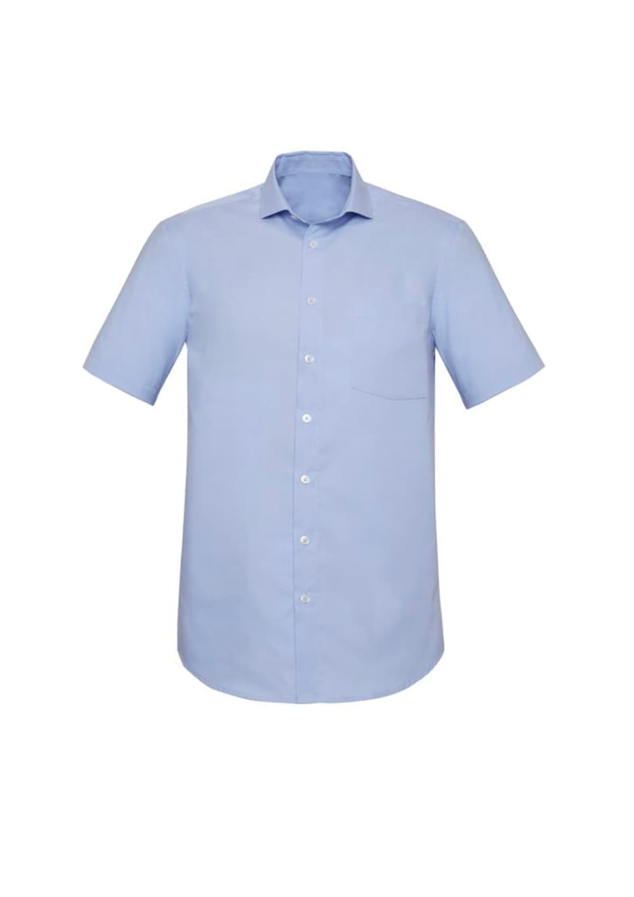 A light blue short sleeve button-up shirt with a pocket and a standard collar. It features a simple design and has a logo.