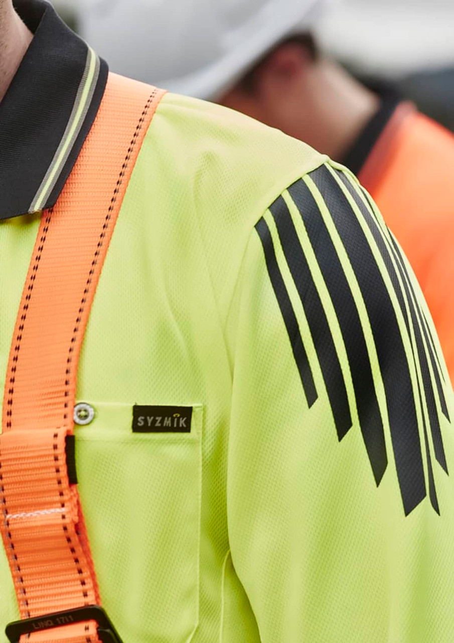 A long sleeve polo in bright yellow with black accents and a branded logo, designed for high visibility safety wear.